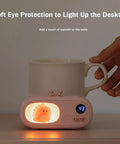 Skip The Lukewarm Vibes Keep Your Morning Brew Sweating Hot On Any Desk With This Smart Electric Coffee Mug Warmer in soft pink.