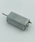 Mini 050 DC Motor 15mm Micro Electric Motor With Precious Metal Brush Runs On 3V 5V 6V Or 9V Great For Budget Friendly Tiny Robotics And RC Projects Smooth Performance One Piece, side view showcasing compact design and metallic housing.