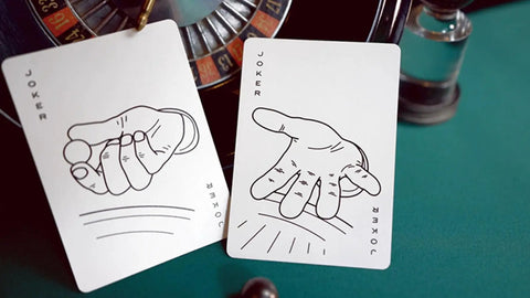 Premium Roulette Casino Playing Cards Crafted For Magicians And Card Sharks Featuring Dope Vintage Graphics, showing two joker cards with hand illustrations.