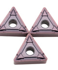 Top Grade 10 Pack TNMG160408 Indexable Carbide Lathe Tools For Stainless Steel External Turning Heavy Duty Cuts With BF MP1125 Inserts showing three triangular inserts close-up.