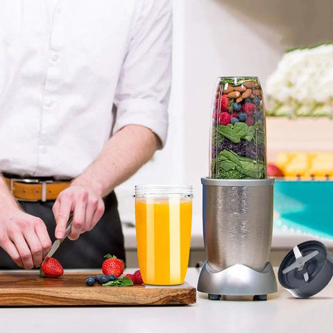 Man preparing smoothie using blender with Top Notch Eight Piece Blender Replacement Blade Kit for 600W and 900W high-speed blenders.