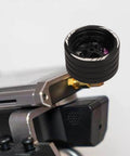RC Steering Wheel Aluminum Alloy Replacement Part for NB4 Transmitter, shown detached above a transmitter with visible screws