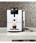 Lock In The Ultimate Morning Perk Up With This Factory Refurbished Automatic Coffee Machine In Sharp Nordic White on countertop.