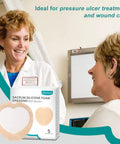 Image of Sacral Wound Dressing Foam Bandage With Silicone Border and two women discussing its use, ideal for ulcer treatment.