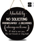10 Inch Wooden No Soliciting Sign For Front Door With Doorbell Sticker Set, Funny Welcome Sign displayed on black round wood