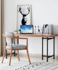 Beefy Industrial Pipe Desk Leg Set 28 Inch Heavy Duty Vintage Style Furniture Legs For Dining Tables Coffee Tables Benches Set Of 2 Durable Cast Iron Hardware supporting a wooden desk in a modern room.