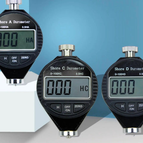 Pro Grade Digital Durometer And Shore A Hardness Tester Designed For Fast Bench Reads With A Sharp High Contrast Display serving three durometers on display.