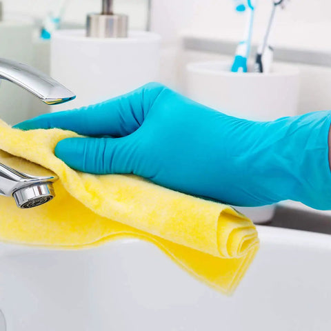 No Sweat Blue Nitrile Exam Gloves Case Of One Thousand Large Size Packs Latex Free Powder Free Formulation With Slick Tactile Feel and Dead Reliable Allergy Safe Shield For Medical Crews Demanding Top Tier Performance Every Shift cleaning a faucet with a yellow cloth.