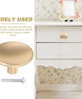 Gold Zinc Alloy Cabinet Pull Handle, Single Hole Door Pull For Wardrobe And Drawer displayed on white furniture