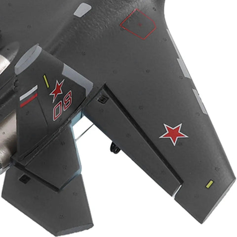 Close-up of SU 35 Jet Style RC Airplane wing and tail with red star decals, brushless tail motor, navy green finish.