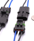 Front view of a pair of 3-pin waterproof automotive connectors with locking latch; black housings and blue/black/white wires.