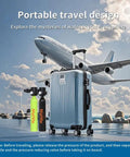 Mini Scuba Tank With Full Face Mask Snorkeling Kit No Hoses Just Breathe 3000 PSI Point Five Liter Underwater Breathing Device Six To Ten Minutes Of Air All In One With Adapter And Air Pump Black travel-friendly design displayed beside luggage with airplane in the background.