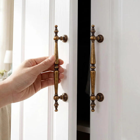 Solid Antique Brass Cabinet Pulls 5 Inch Drawer Handles 5 Pack vintage zinc alloy, hand opening cupboard knobs on white cabinet.