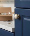 Crackle Finish Ceramic Cabinet Knobs With Heavy Duty Zinc Alloy Core Decorative Furniture Hardware Badass Grip Quality Sweet Vintage Charm Smooth Kitchen Bedroom Bathroom Drawer Handle Setup on blue cabinet.