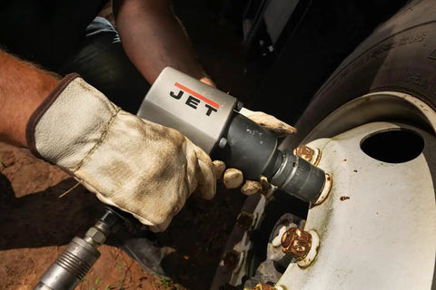 Heavy Duty 1 Inch Pistol Grip Aluminum Impact Wrench Dropping Badass 1500 Ft Lbs Torque being used on a truck tire.