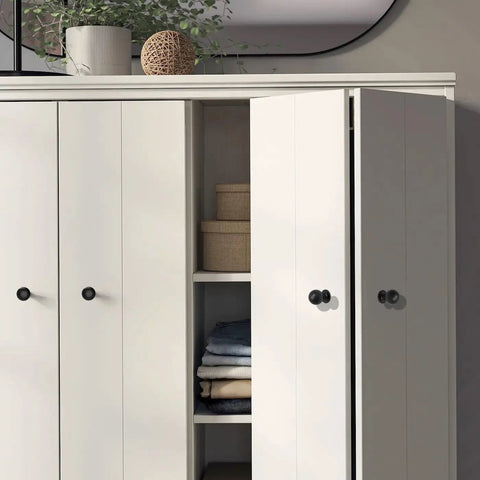 Matte Black Cabinet Knobs Four Pack With Wide Backplates shown on white bi-fold closet doors in modern interior