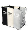 Three-section laundry sorter with metal frame, labeled 'Dark Laundry,' 'Light Laundry,' and 'Color Laundry' sections.