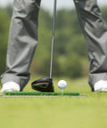 Golfer using Backyard Golf Hitting And Putting Mat With Durable Rubber Backing For Real Course Feel 1 By 2 Foot Green Turf outdoors