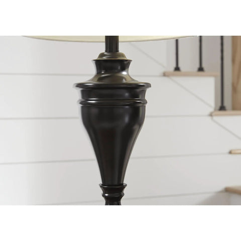Close-up of the pedestal base of a Bronze Traditional Table Lamp With Fabric Hardback Shade And Pedestal Base, Metal Construction, 3 Way Switch, UL Listed, 28.5 Inch Tall, Ideal Reading Light For Bedroom Or Living Room, Creates A Cozy Vibe And Classic Charm.