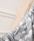 Close-up of grey Chill Nylon Baby Hammock Swing fabric, featuring white polka dots and ruched design for indoor or outdoor use.