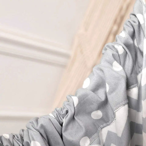Close-up of grey Chill Nylon Baby Hammock Swing fabric, featuring white polka dots and ruched design for indoor or outdoor use.
