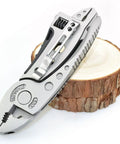 Two Piece Portable Stainless Steel Multitool Pliers Set With Wire Cutters And Multi Purpose Wrench on wooden surface
