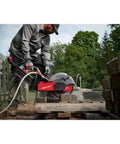 Heavy Duty 14 Inch Cordless Power Cut Off Saw Built Like A Tank For Knocking Out Clean Slots In Concrete And Steel Rebar With Instant Kickback Guard and Push Button Activation in action cutting through concrete.