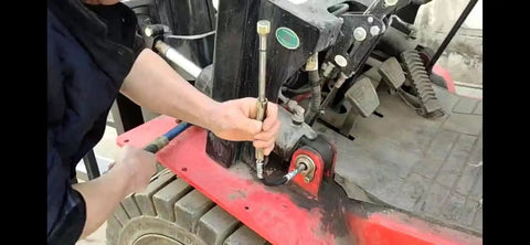 Mechanic using Grease Joint Cleaning Kit For Flushing Hardened Grease From Shafts And Bushings Pro Grade Tool on machinery