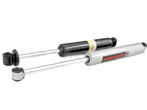 Pair of Rough Country front shocks, silver and black, for Chevy/GMC 1500 2WD pickup.