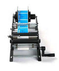 Cool Handheld Semi-Automatic Label Printer For Round Bottles And Jars Easy Manual Tape Dispenser Machine for Small Business Packaging Efficient Sticker Applicator Tool with blue labels and manual crank.