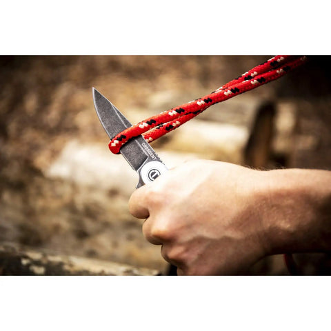 3 1/4 Inch Drop Point Pocket Knife With Aluminum Handle cutting rope, D2 Steel Blade, Smooth Ball Bearing Deployment shown in use