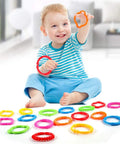 Child playing with Link To Go Baby Rings Toy Kit For Stroller Car Seat Crib Clip On Play Mat Early Education Set, 18-Piece Colorful Sensory Rings For Infants And Toddlers, Travel Accessory That Sparks Touch Sight And Learning.