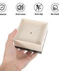 Hand holding a pad from 4 Pack Chair Leg Floor Protectors Glide Covers With Wear Resistant TPU Foot Pads For Wooden Floors