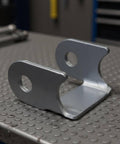 Heavy Duty Swing Arm And Control Arm Bracket Kit With Reinforced Bushings For Trail Beaters And Dirt Track Shock Absorber Mounts on a workbench.