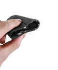 Person holding black rubber automotive component, possibly a seal or gasket, demonstrating flexibility and texture in hand.