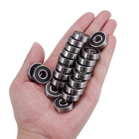 Hand holding 100 Pack 608 Bearings Pre Lubricated Deep Groove Ball Bearings 8x22x7mm C3 High Speed Double Sealed