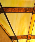 Close-up of Tiffany Style 12 Inch Wide Wall Sconce Lamp With Stained Glass Mission Shade, showcasing the handcrafted glass design.