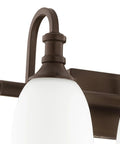 Close-up of the Three Light Bathroom Vanity Light in Oiled Bronze with Clear Seeded Glass from the Richmond Collection mount detail.