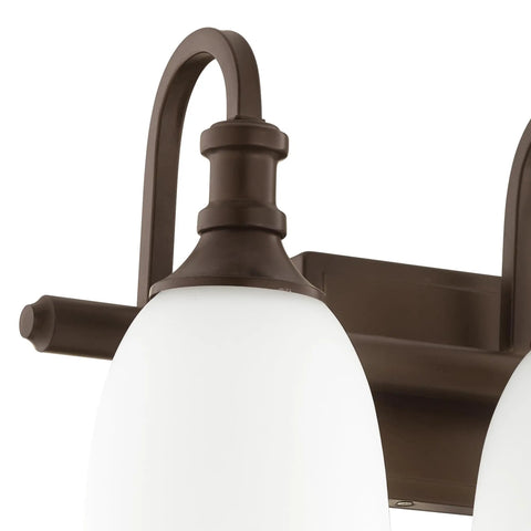 Close-up of the Three Light Bathroom Vanity Light in Oiled Bronze with Clear Seeded Glass from the Richmond Collection mount detail.