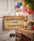 Funny No Admittance Except On Party Business Sign Rustic Wood Wall Decor with jute hanger on door at colorful party scene