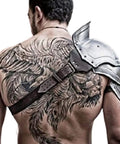 Back view of Handcrafted Steel Pauldron Armor for Gladiators and LARP on a tattooed shoulder demonstrating battlefield style.