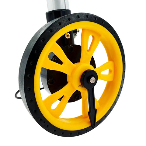 Close-up view of the roll out digital measuring wheel's yellow gear wheel, showcasing heavy-duty design for accurate distance tracking.