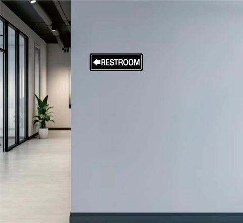 Left Arrow Restroom Sign For Businesses Durable Frosted Acrylic With Super Strong Self Adhesive Simple Fast Install 9 By 3 Inches Black Directional Office And Commercial Premises Sign displayed on office wall.