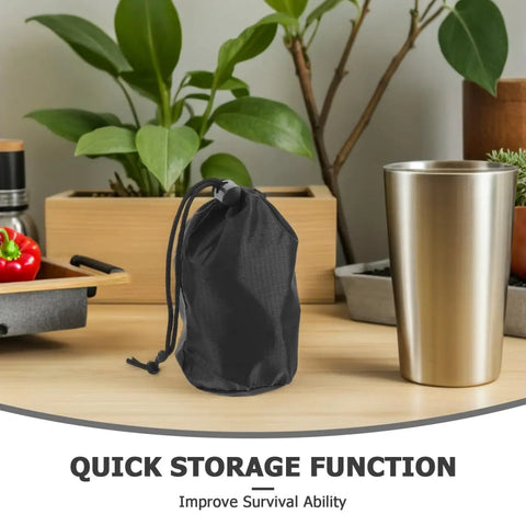 Black drawstring pouch from Two Pack Waterproof Rain Gear Storage Bags With Drawstring Pouches For Quick Access Rain Poncho Organizer For Cycling Hiking Camping And Travel on a table with plants and drinkware.