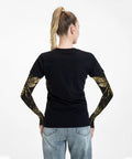 Back view of woman wearing premium cooling arm sleeves featuring a steampunk gear print for UV blocking outdoor workouts.