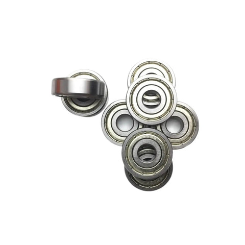 Check Out These Awesome 2 Pack Of 6205ZZ Deep Groove Ball Bearings Measuring 25 By 52 By 15 Millimeters With Abec Three Precision Rating Designed For Heavy Duty Industrial Drilling Applications That Need To Get It Done Without Any Wobbling Or Friction - group of ball bearings on a white background.