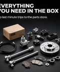 Complete auto parts repair kit with cables, bearings, brake disc, and hardware arranged next to a labeled box.