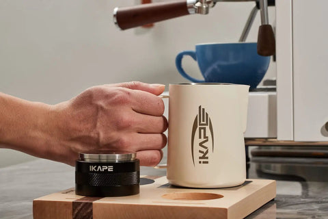 Person using Espresso Tamper Base And Accessories Organizer In Natural Walnut All Size Portafilter Compatible Tamping Station Holder.