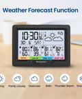 Four Zone Wireless Indoor Outdoor Weather Station With Digital Atomic Clock And Temperature Humidity Monitor, black display on table