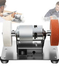 Super Cool 3000-6000Rpm Mini Bench Grinder With Dual Grinding Wheels, 7 Speed Settings And Reversible Motor on a stable base.